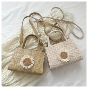 Detailed weave pattern of woven crossbody bags with elegant sunflower decorative motifs