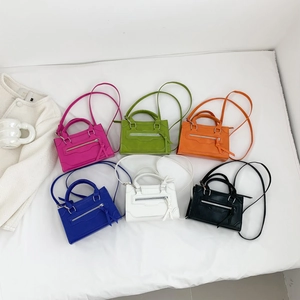 Fashion mini crossbody bag in six bright colors with top handles and tassels