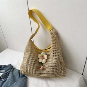 Handmade woven tote bag with 3D floral accent and yellow leather straps for summer style