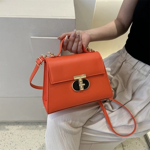 Fashionable orange PU leather square handbag with top handle and gold T-lock closure