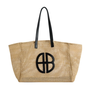 Large straw woven tote bag with black BB logo and leather handles for summer fashion