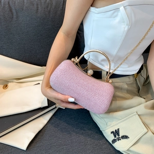 Pink sequin evening clutch bag with pearl clasp and metal handle for women