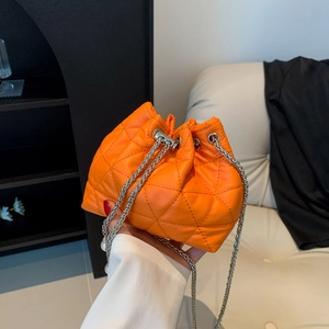 Orange quilted PU leather bucket bag with silver chain drawstring and pearl accents