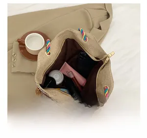 Top view of spacious jute tote bag interior with braided handles and daily essentials