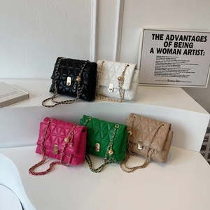 Quilted chain shoulder bags in five colors displayed on a modern minimalist art stage