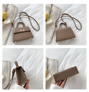 Detailed views of brown faux crocodile leather bag with gold hardware and top handle