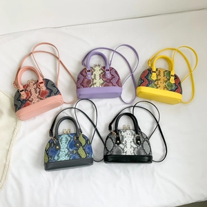 Chic snakeskin texture shell bags in diverse colors with handles and crossbody straps