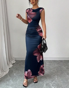 Detail of ruched waist design on a navy slim maxi dress with pink floral prints