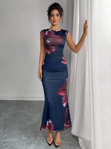 Macro detail of slim-fit sleeveless floral dress with elegant deep blue pattern design