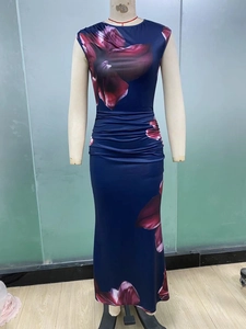 Detail of waist ruching and red floral print on sleeveless navy bodycon maxi dress
