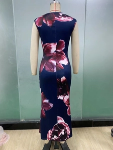 Back view of a slim sleeveless long dress with floral print on a mannequin
