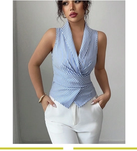 Detail of blue striped sleeveless wrap blouse with V-neckline and flattering waist tie