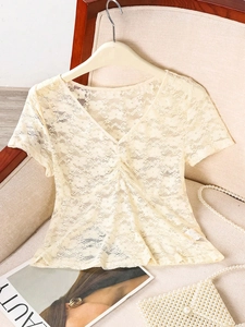 Detailed view of floral lace short sleeve top with V-neckline and drawstring bust