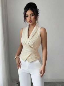 Detailed view of yellow striped sleeveless wrap top with elegant shawl collar design