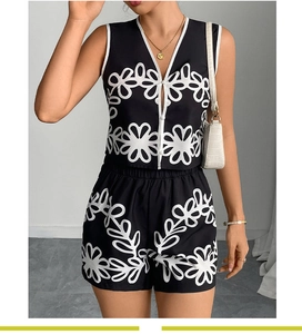 Detail of V-neck sleeveless top and printed shorts set with abstract floral patterns