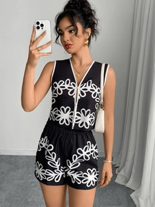 Women's summer vacation two-piece set featuring a V-neck vest and floral shorts in black