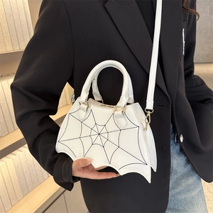 White leather bat-shaped crossbody bag with black spider web embroidery for Halloween
