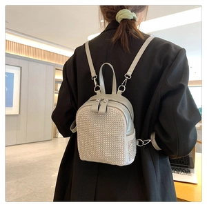 Detail view of mini grey backpack with sparkling silver rhinestones and adjustable straps