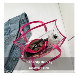 Capacity display of clear PVC tote bag with rose red leather trim and inner pouch