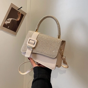 Beige leather crossbody bag with glitter finish and square buckle for elegant women