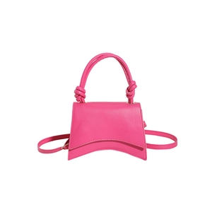 Fuchsia hourglass handbag with knotted handles and a detachable crossbody strap
