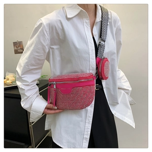 Detail of pink rhinestone belt bag with matching mini round pouch and striped strap