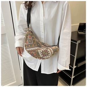 Ethnic style crescent crossbody bag with colorful geometric patterns and black strap