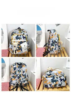 Detail view of floral camo backpack featuring front accessory pouch and plush bear charm
