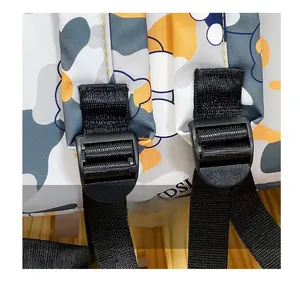 Detail of adjustable black nylon shoulder strap with buckle on floral camouflage backpack