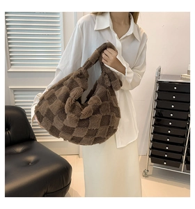 Detail of soft dark brown checkered faux fur tote bag showing plush texture