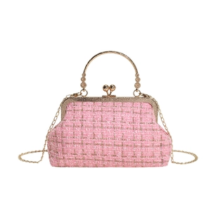 Pink tweed doctor bag with gold bead handle and chain strap for women shown on white background