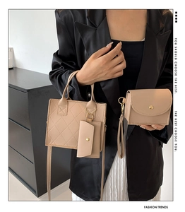 Three-piece beige quilted handbag set with tote, crossbody bag and hanging coin purse