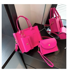 Detail of quilted rose pink tote set with golden chain hardware and matching crossbody bag