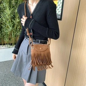 Retro brown faux suede crossbody bag with layered tassels and knotted shoulder strap