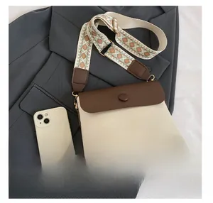 Detail presentation of color-block retro crossbody bag with wide jacquard shoulder strap