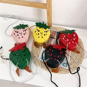 Cute strawberry-shaped children's crossbody bags in five colors with funny cartoon faces