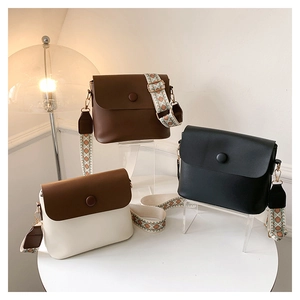 Three colors of retro leather crossbody bags featuring stylish ethnic jacquard straps