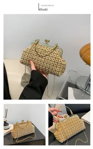 Detail of khaki woven crossbody bag with gold doctor-style clip and textured knit pattern