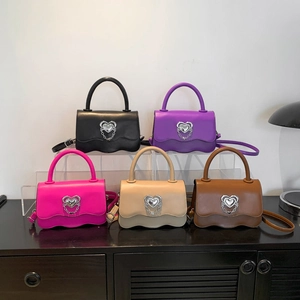 Stylish crossbody bags in multiple colors featuring wavy flap and heart-shaped metal buckle