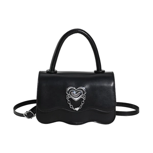 Chic black leather handbag with silver heart buckle and wavy flap for women