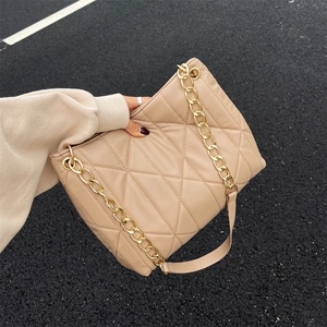 Beige quilted shoulder bag with gold chain strap, minimalist tote in solid color finish