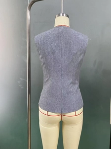 Detailed back view of grey sleeveless vest with waist-cinching seam and heather texture