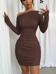 Detail of the ruched texture and slim fit design on this one-shoulder mini dress