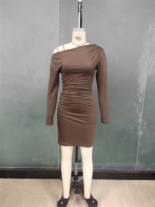 Detail view of the elegant brown one-shoulder ruched dress with long sleeves and slim fit