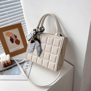 Chic cream quilted tote bag with top handles and silk scarf detail for women
