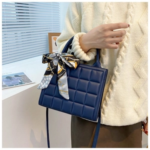 Deep blue checkered tote bag with decorative silk scarf and adjustable long strap