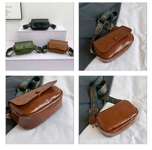 Detail of vintage PU leather crossbody bag with ethnic style wide shoulder strap