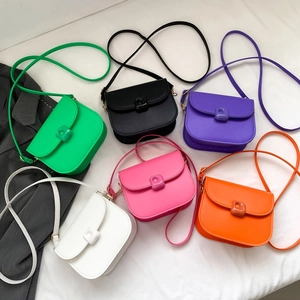 Fashionable matte saddle shoulder bag shown in six vibrant solid dopamine colors