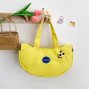 Cute yellow banana shaped canvas tote bag with KeepKind embroidery and smiley face icon