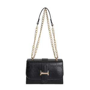 Black crocodile pattern crossbody bag with gold H-buckle and chain strap on white background